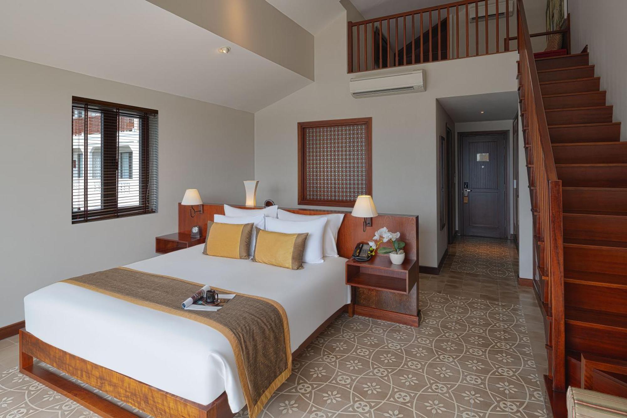 Rivertown Hoi An Resort & Spa Esterno foto A bedroom at the hotel